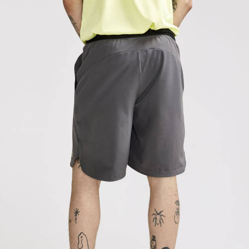 Padel-shorts-med-logo-craft-graa-bagpaa